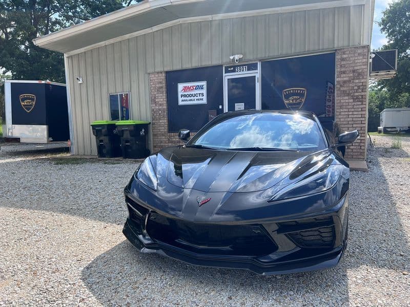 Black Chevrolet Corvette parked outside the Grimeaway Autoworks shop in Ada, OK