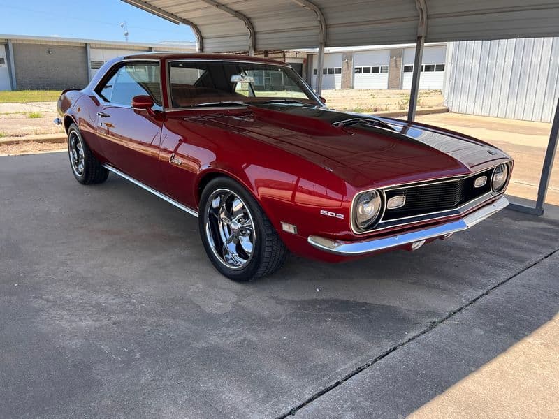 Restored red Chevrolet Camaro classic car after detailing by Grimeaway Autoworks